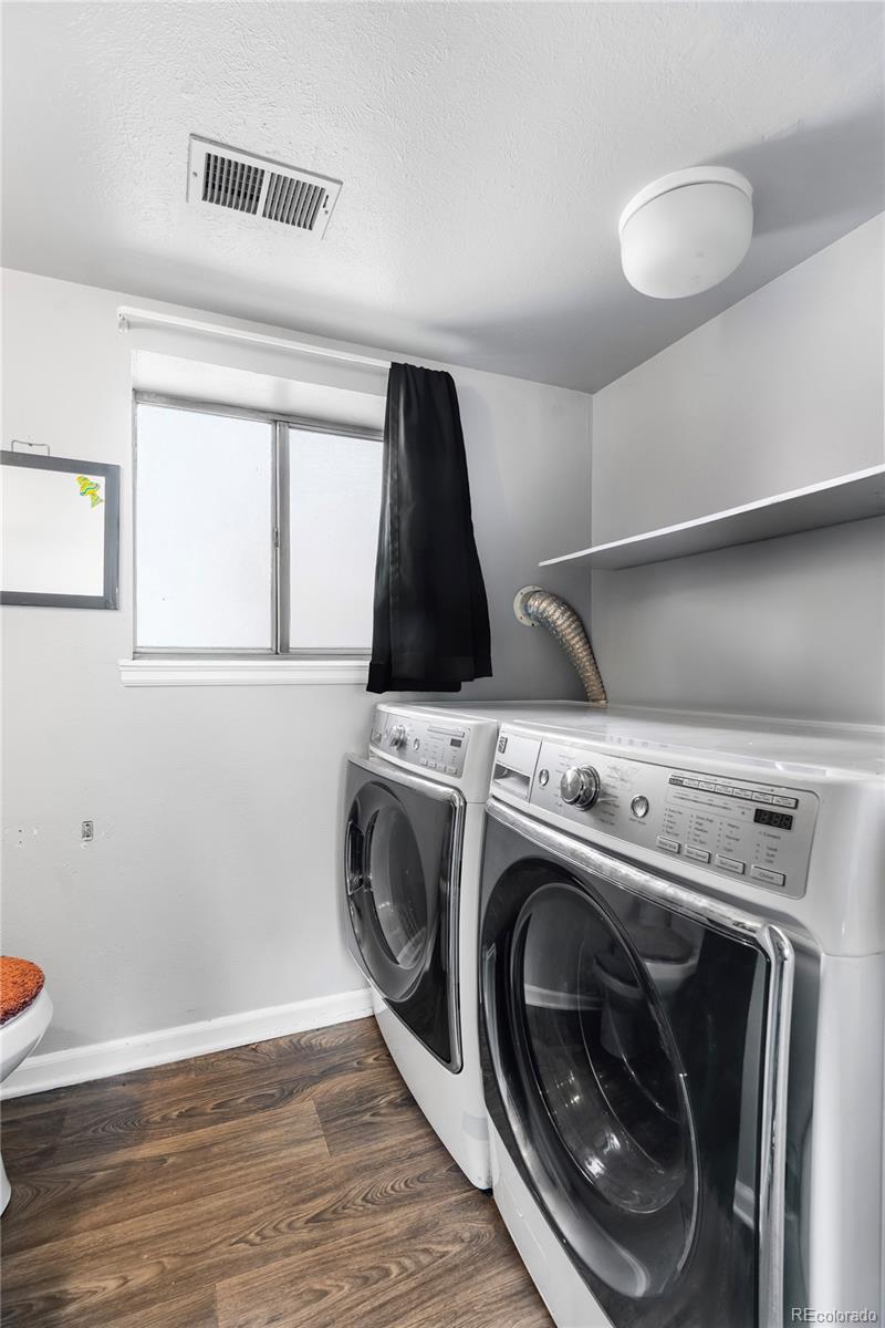 4609 Fontana Way Denver, CO 80239 - Photo 17 of 22 a utility room with dryer and washer