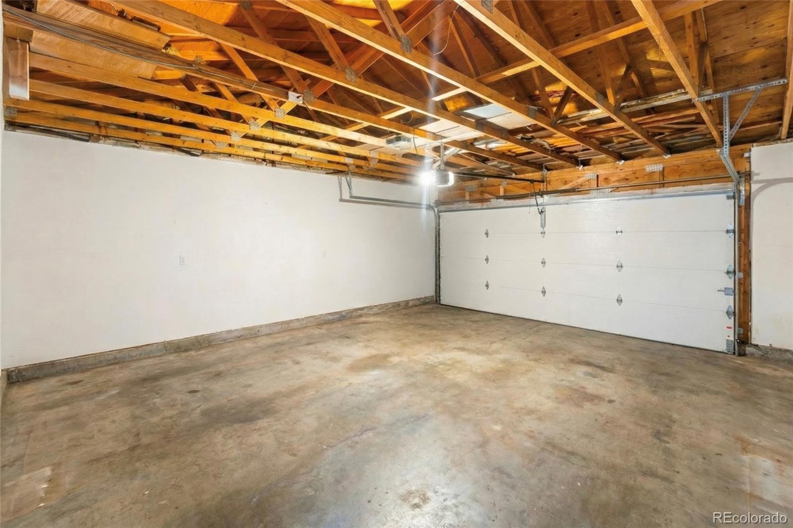 4609 Fontana Way Denver, CO 80239 - Photo 18 of 22 a view of a room with wooden floor