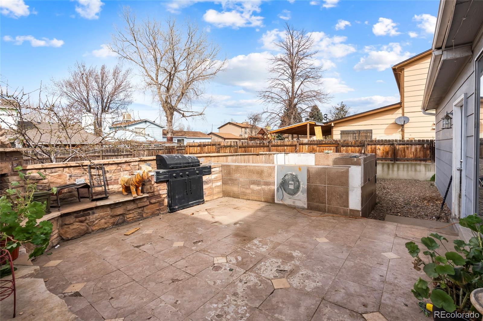 4609 Fontana Way Denver, CO 80239 - Photo 20 of 22 a view of a yard with an outdoor space