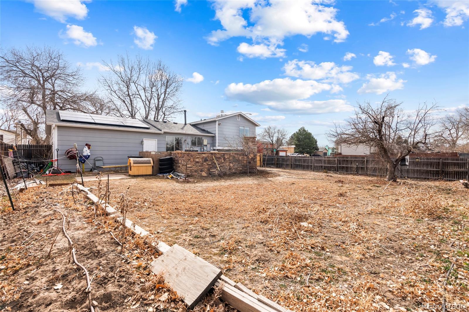 4609 Fontana Way Denver, CO 80239 - Photo 22 of 22 a view of a yard with a house