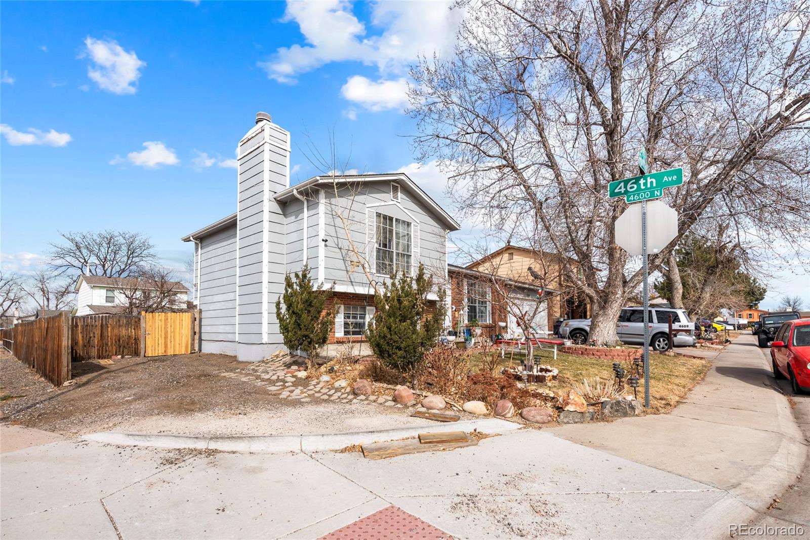 4609 Fontana Way Denver, CO 80239 - Photo 3 of 22 a view of a house with snow on the road