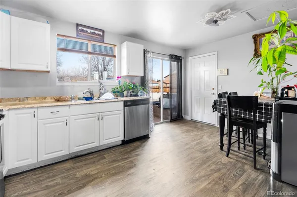 a kitchen with a table and chairs in it
