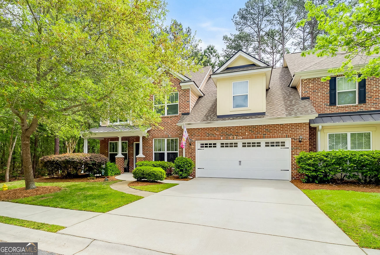 150 Royal Lane Pooler, GA 31322 - Photo 1 of 38 a front view of a house with a garden and plants