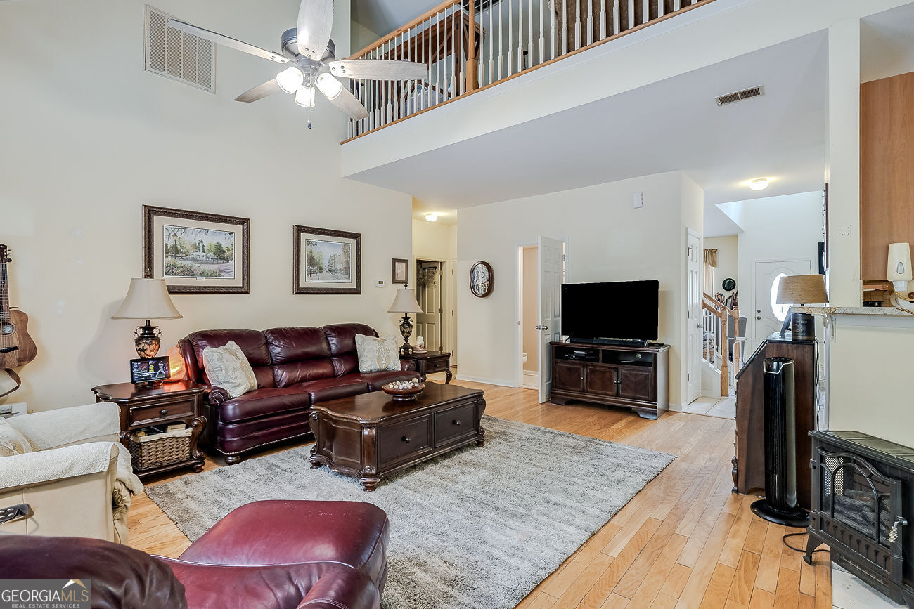 150 Royal Lane Pooler, GA 31322 - Photo 11 of 38 a living room with furniture and a flat screen tv
