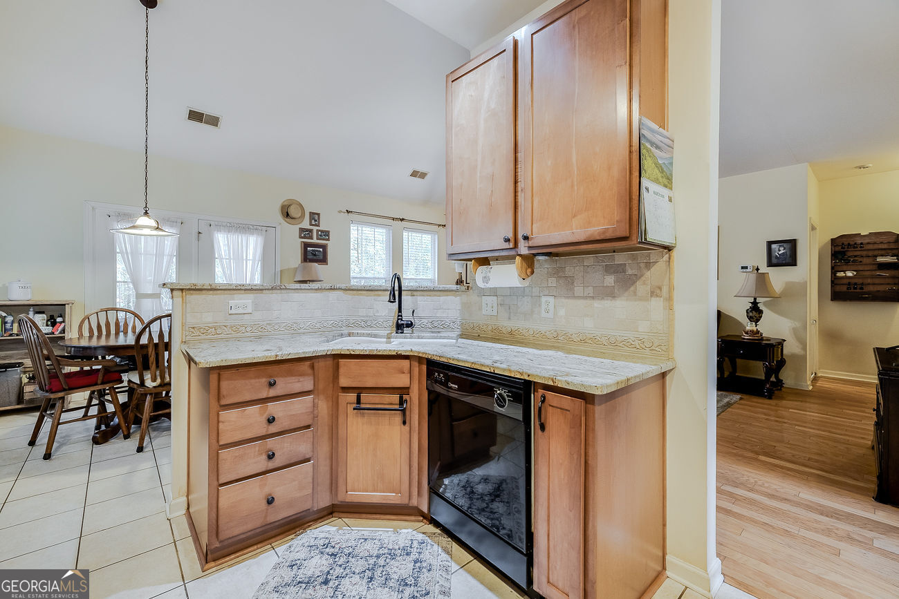 150 Royal Lane Pooler, GA 31322 - Photo 18 of 38 a kitchen with a sink stove and cabinets