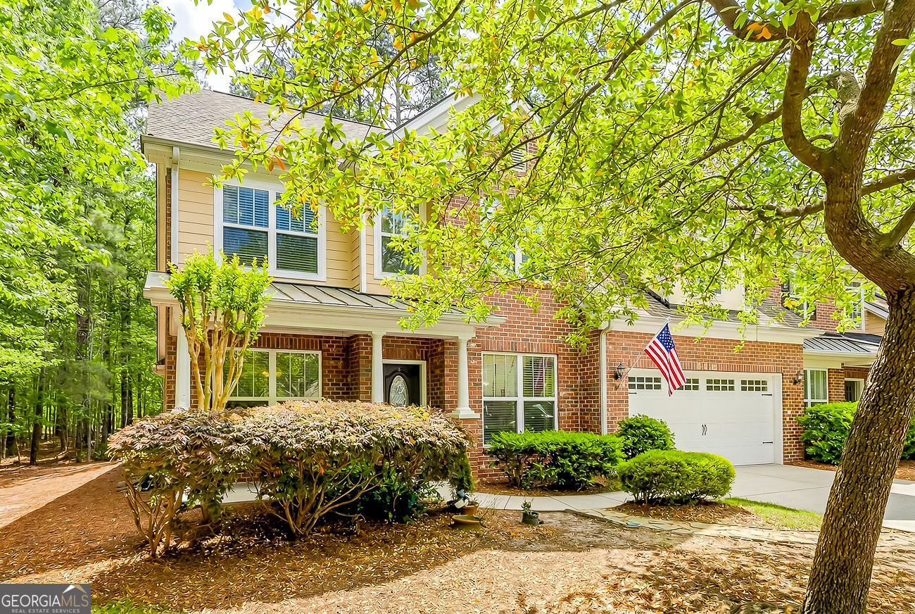 150 Royal Lane Pooler, GA 31322 - Photo 2 of 38 a front view of a house with garden