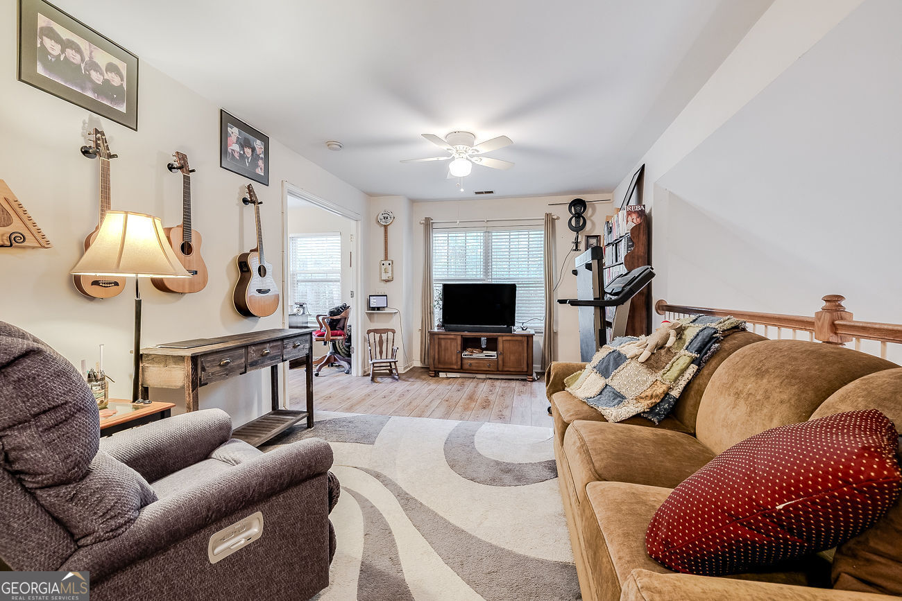 150 Royal Lane Pooler, GA 31322 - Photo 26 of 38 a living room with furniture and a flat screen tv