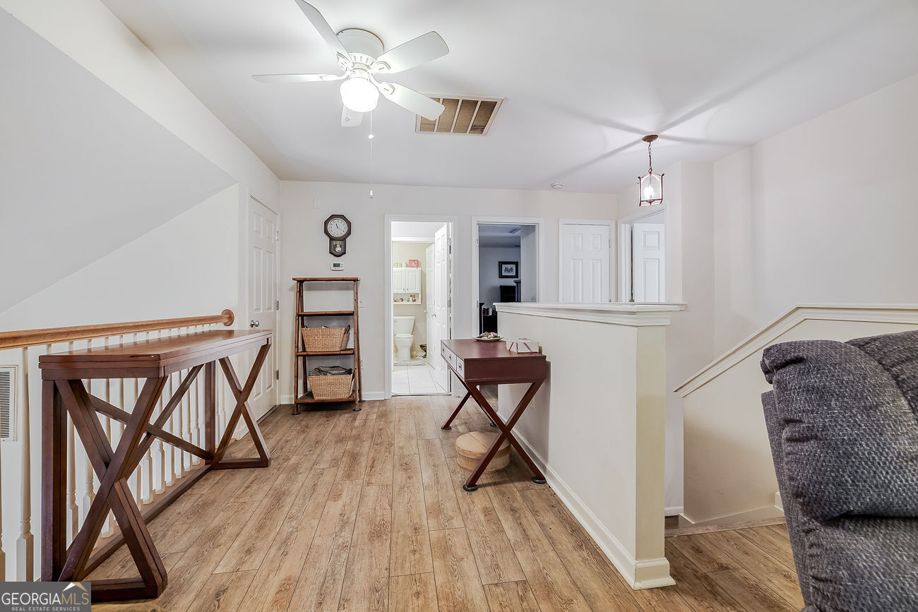150 Royal Lane Pooler, GA 31322 - Photo 27 of 38 a view of a livingroom with furniture and a hardwood floor