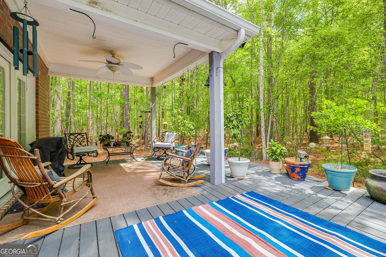 150 Royal Lane Pooler, GA 31322 - Photo 36 of 38 a living room with patio furniture and a floor to ceiling window