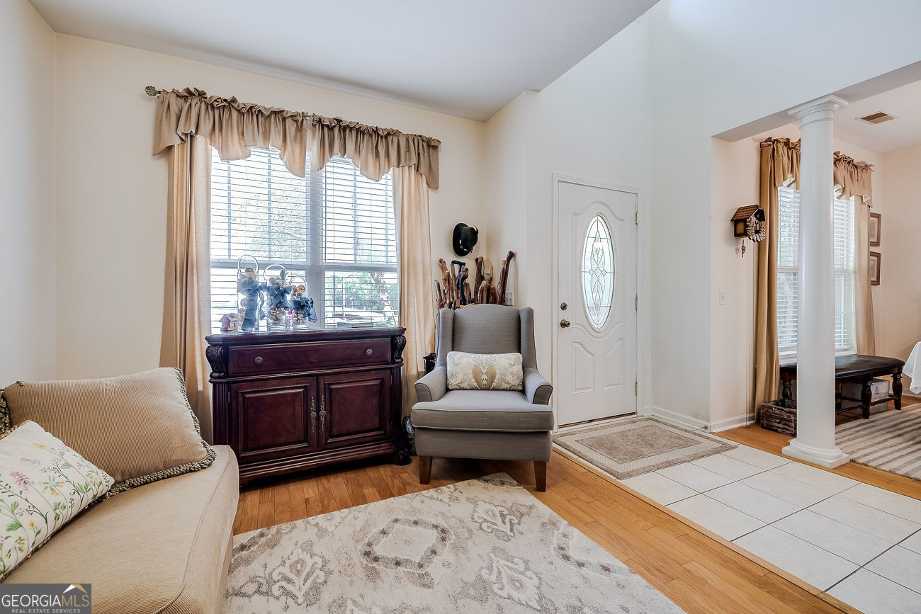 150 Royal Lane Pooler, GA 31322 - Photo 5 of 38 a living room with furniture and a large window