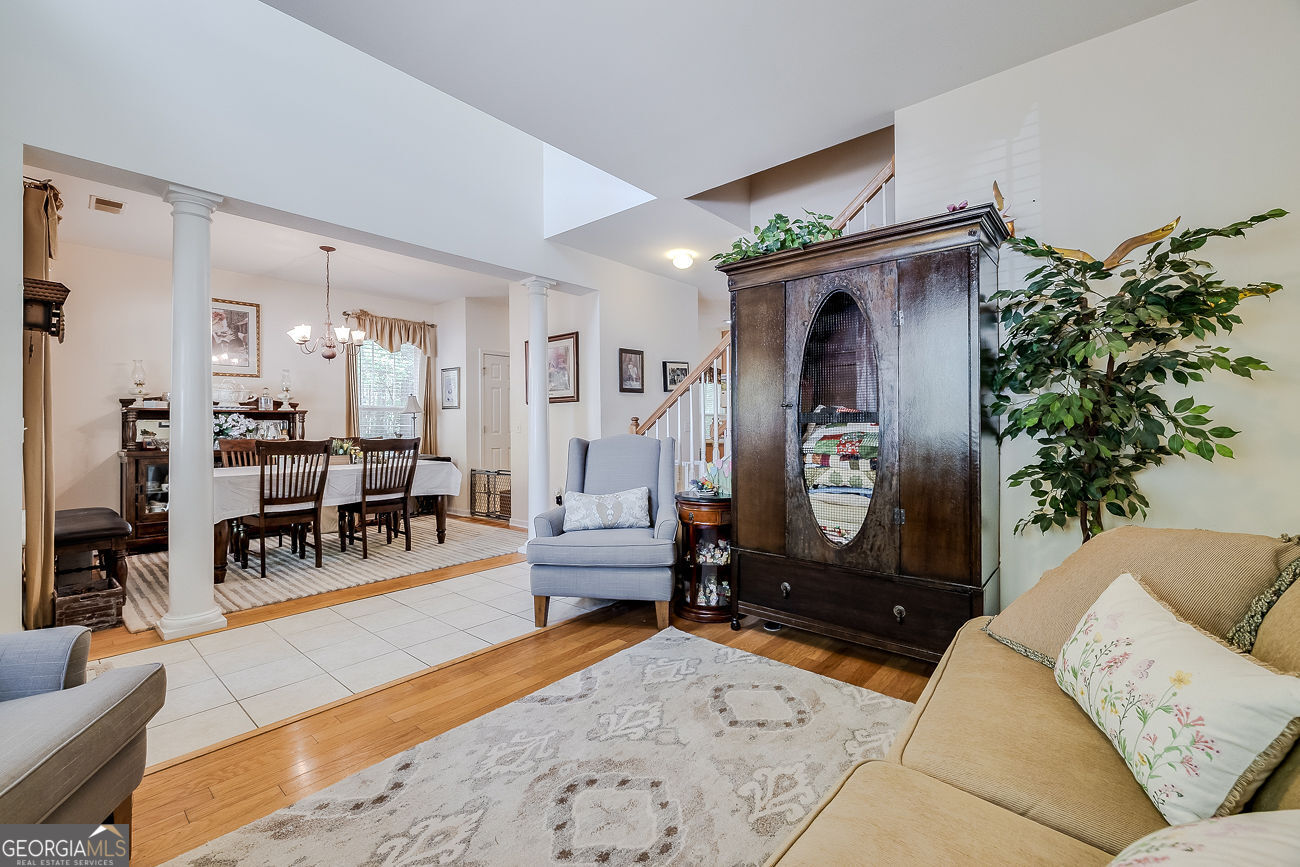 150 Royal Lane Pooler, GA 31322 - Photo 6 of 38 a living room with furniture a piano and a potted plant