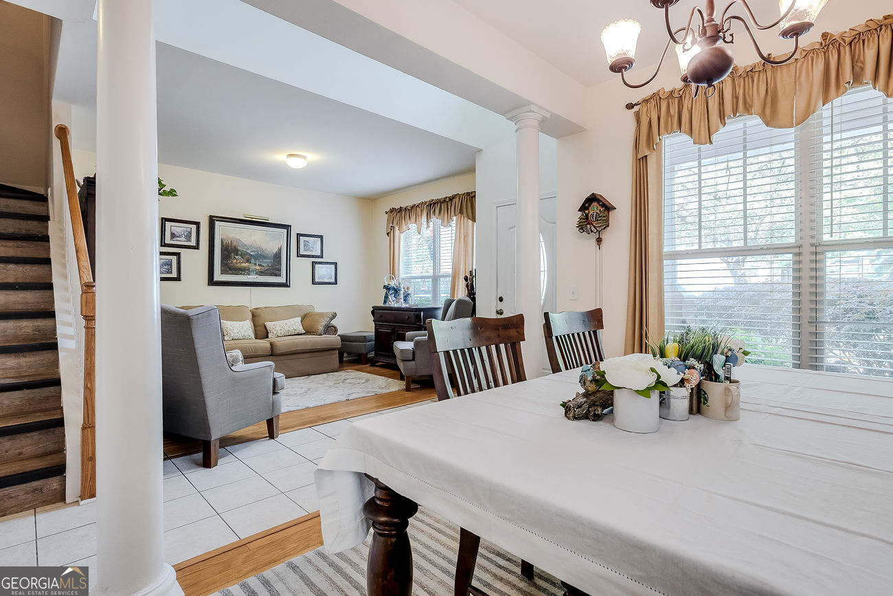 150 Royal Lane Pooler, GA 31322 - Photo 8 of 38 a view of a dining room with furniture and a large window