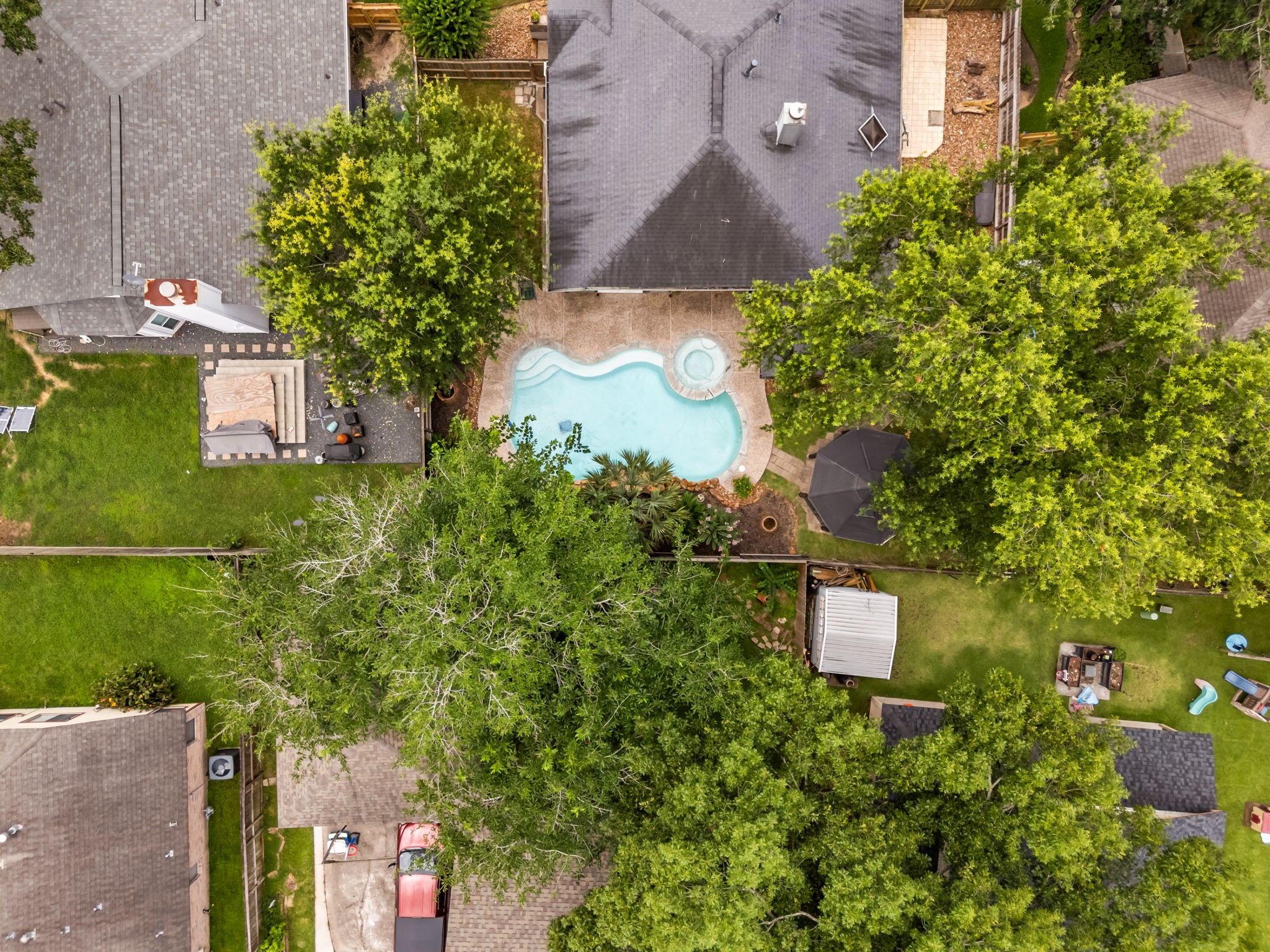 1915 Mercoal Drive Spring, TX 77386 - Photo 43 of 50 Aerial perspective showcasing the private pool and landscaped backyard.