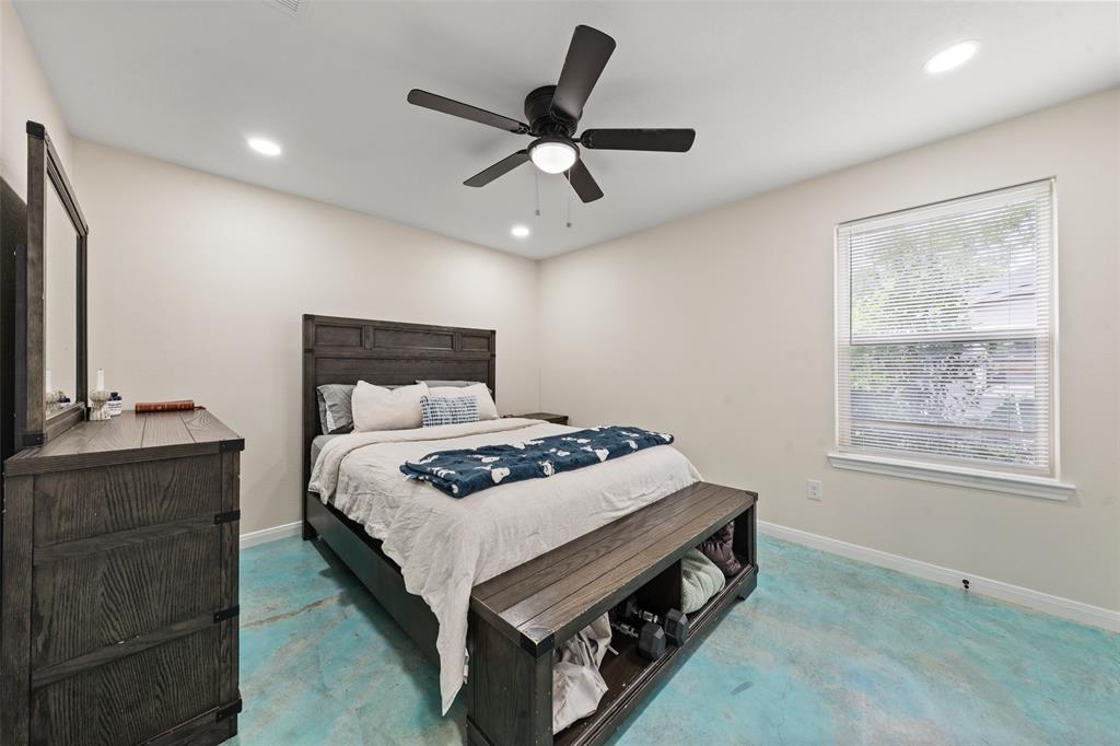 3109 North 27th Street Waco, TX 76708 - Photo 10 of 17 a bed sitting in a bedroom next to a window