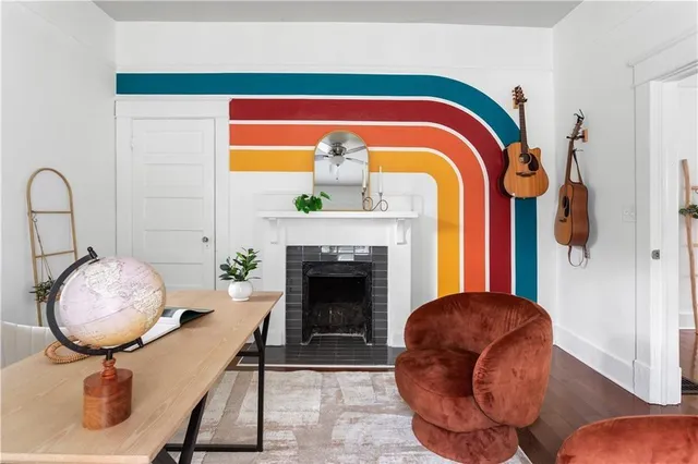 a living room with furniture and a fireplace