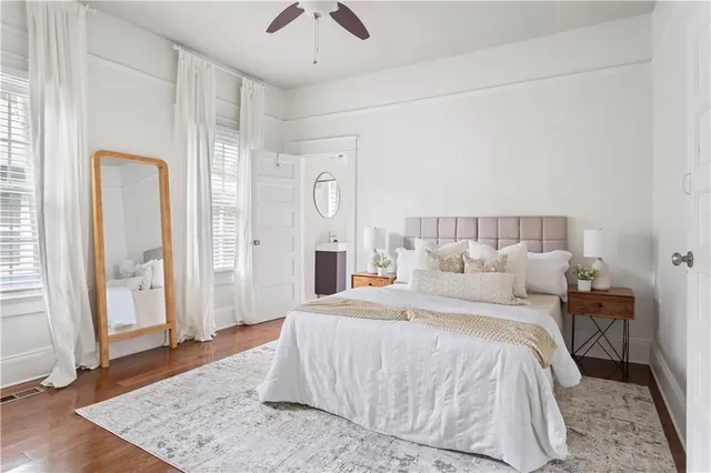 a bed room with a bed and a mirror