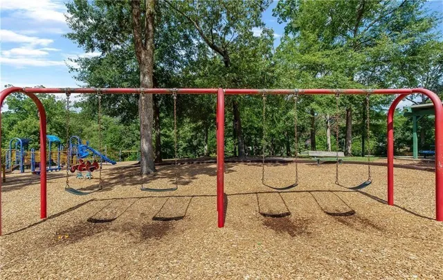 a view of yard with swimming pool and sitting space