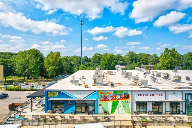 a view of a large building with a big yard
