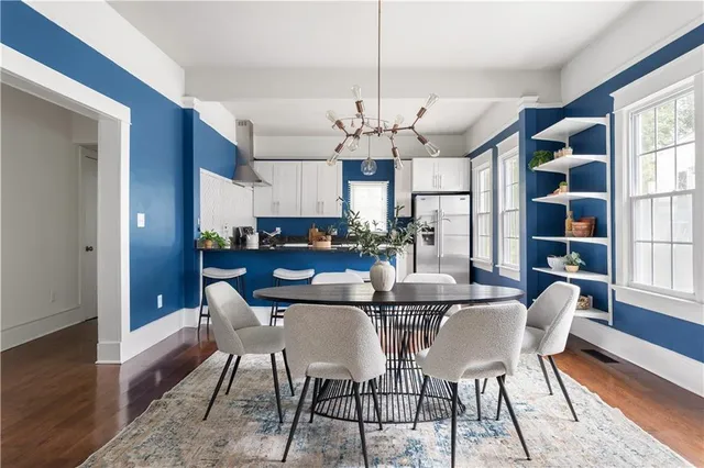 a view of a dining room with furniture window and wooden floor