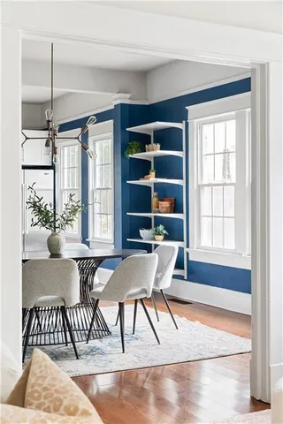 a dining room with furniture and window