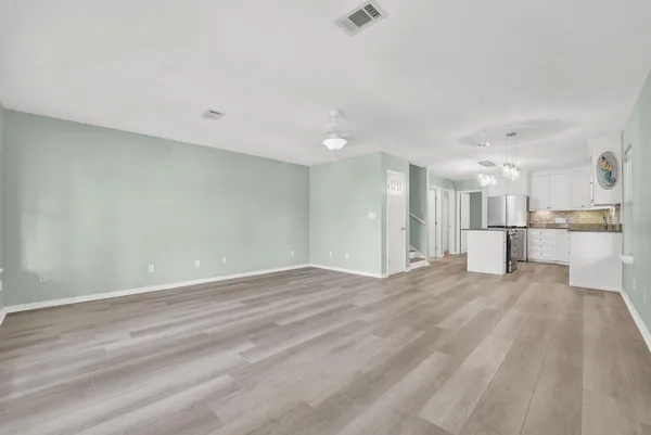 a view of kitchen with wooden floor