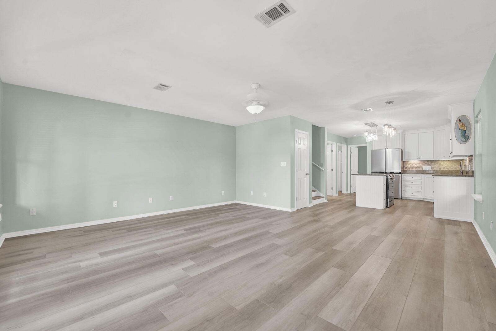 a view of kitchen with wooden floor