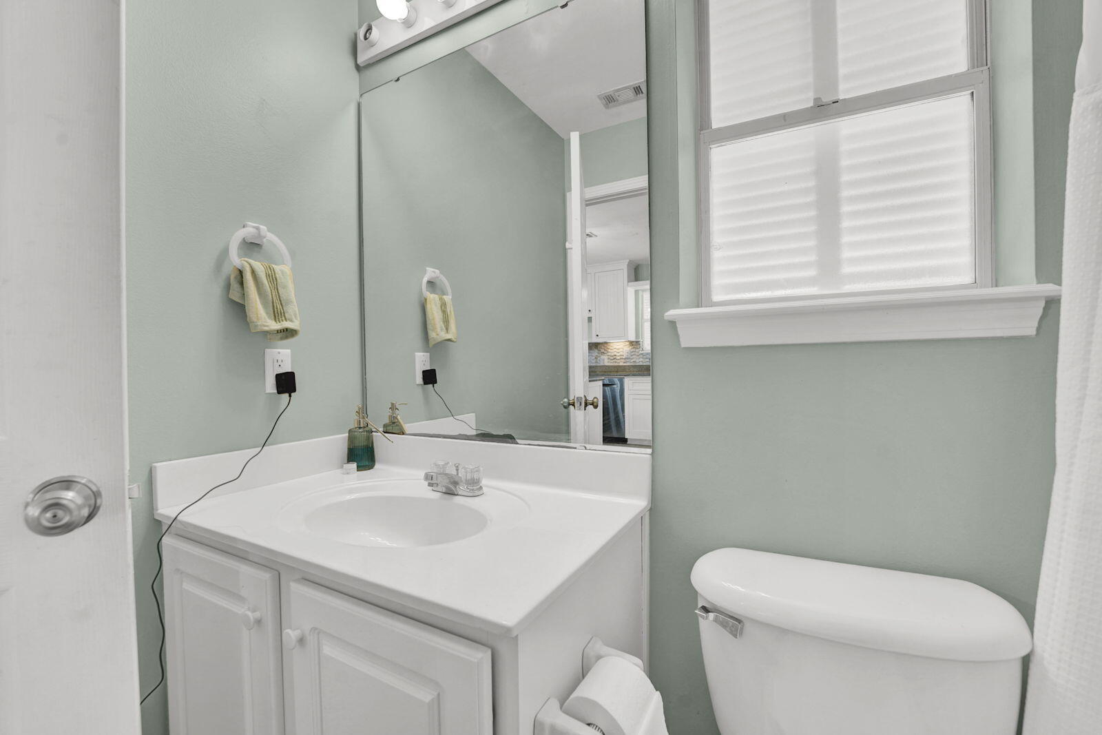 93 Beachfront Trail Santa Rosa Beach, FL 32459 - Photo 15 of 42 a bathroom with a toilet a sink a mirror and a window