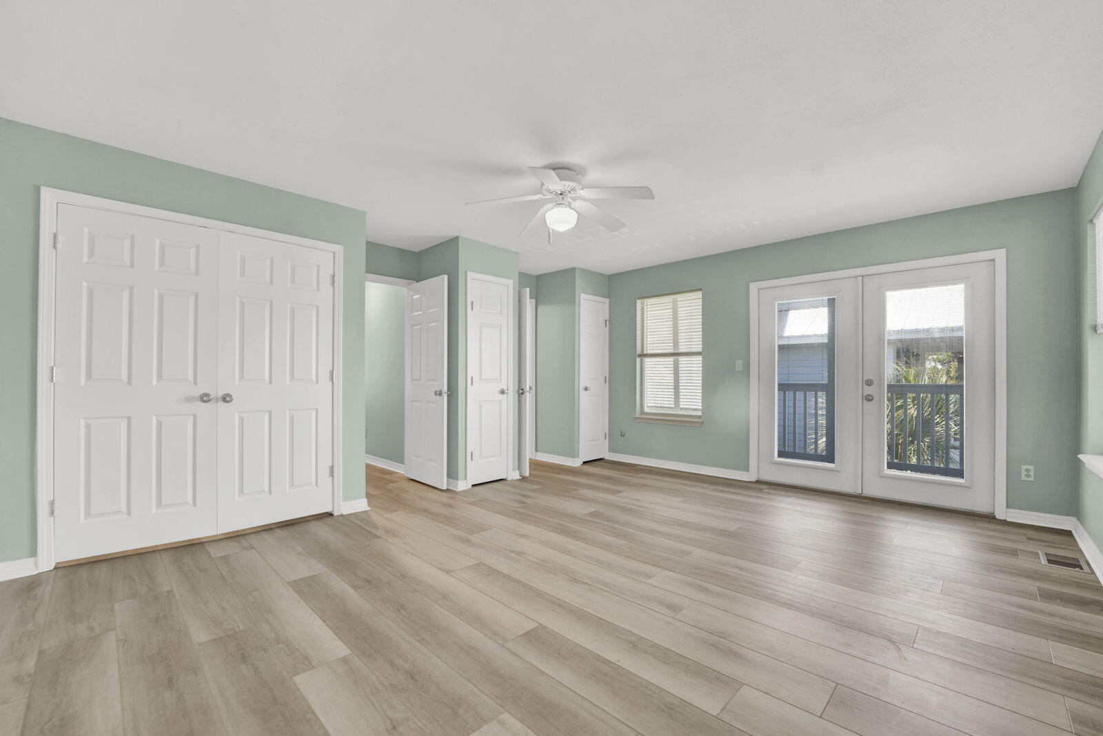 93 Beachfront Trail Santa Rosa Beach, FL 32459 - Photo 17 of 42 an empty room with wooden floor and windows