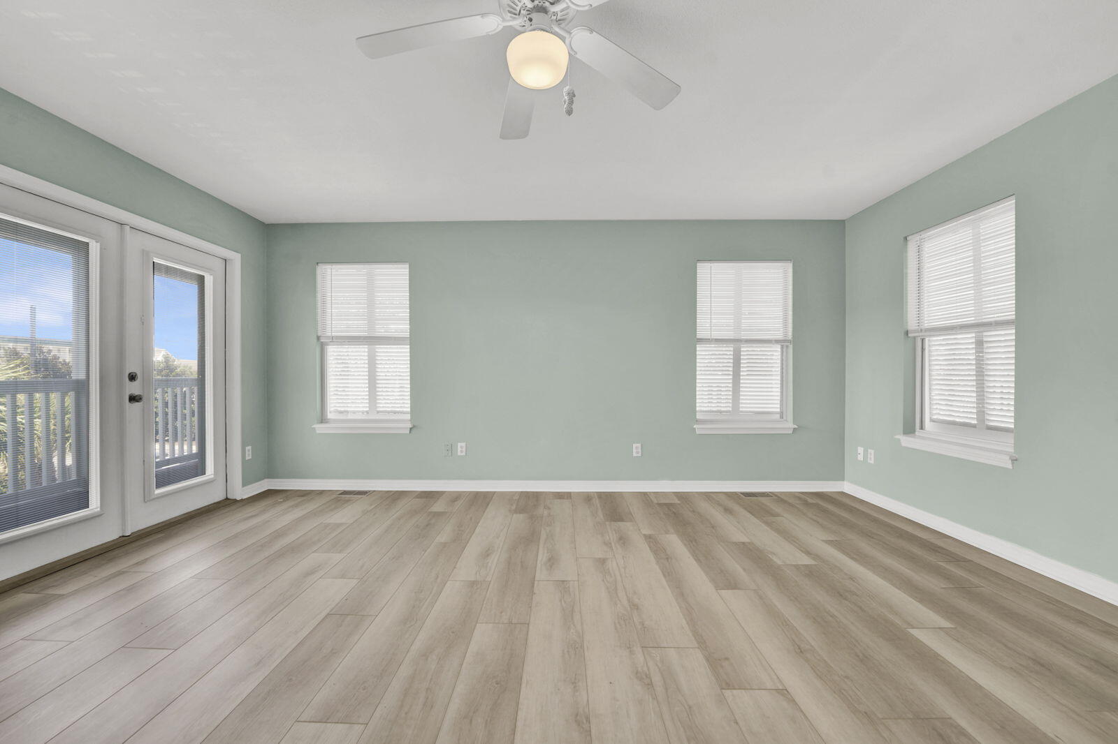 93 Beachfront Trail Santa Rosa Beach, FL 32459 - Photo 18 of 42 an empty room with wooden floor and windows