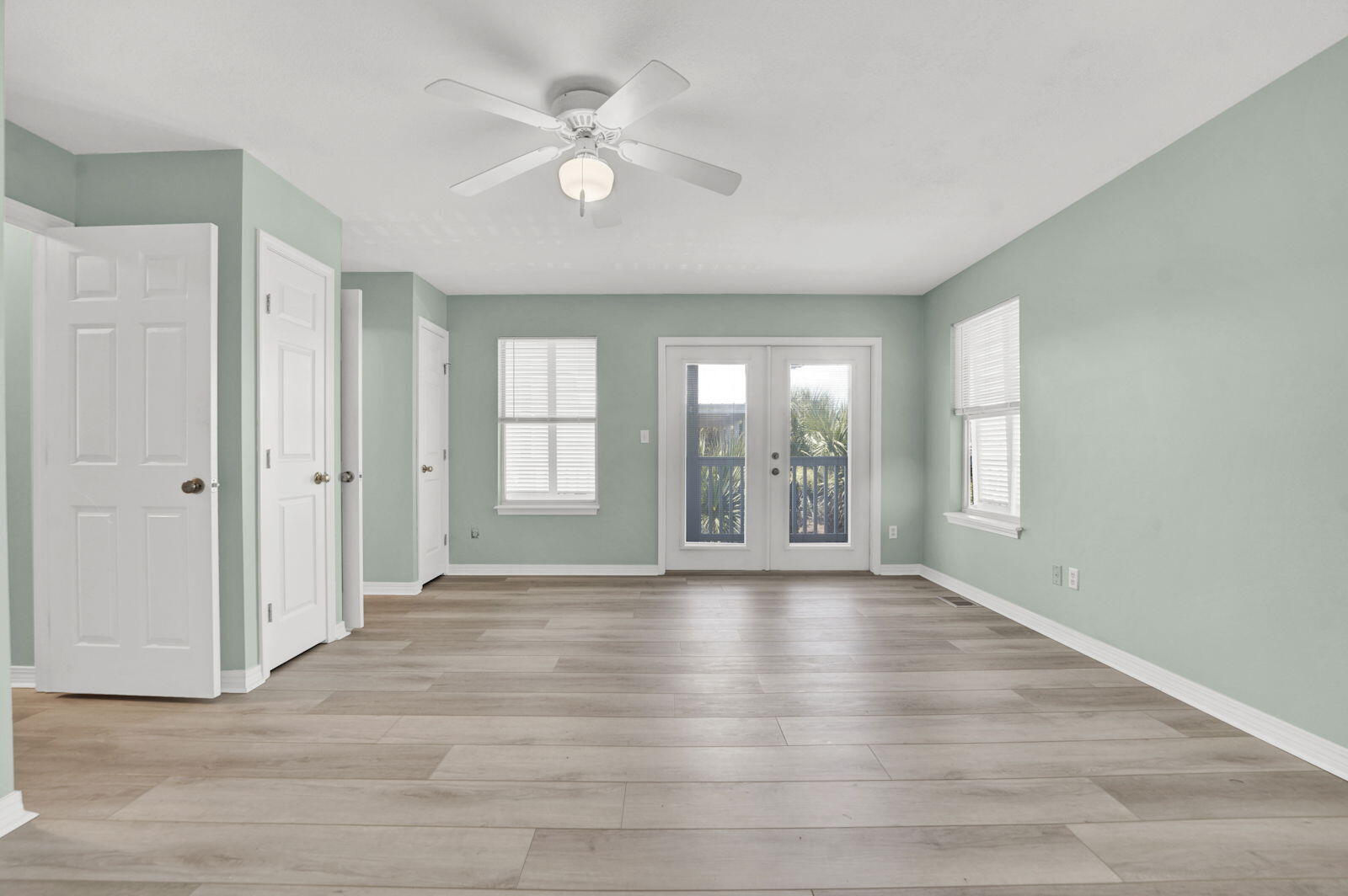 93 Beachfront Trail Santa Rosa Beach, FL 32459 - Photo 19 of 42 a view of an empty room with a window and wooden floor