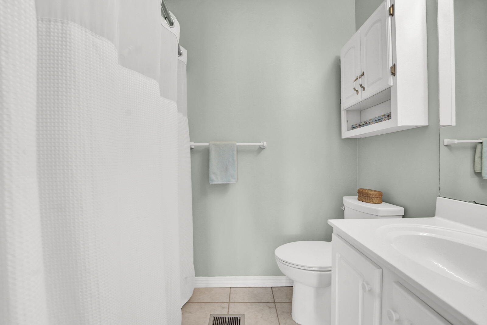 93 Beachfront Trail Santa Rosa Beach, FL 32459 - Photo 30 of 42 a white toilet sitting next to a bathroom sink