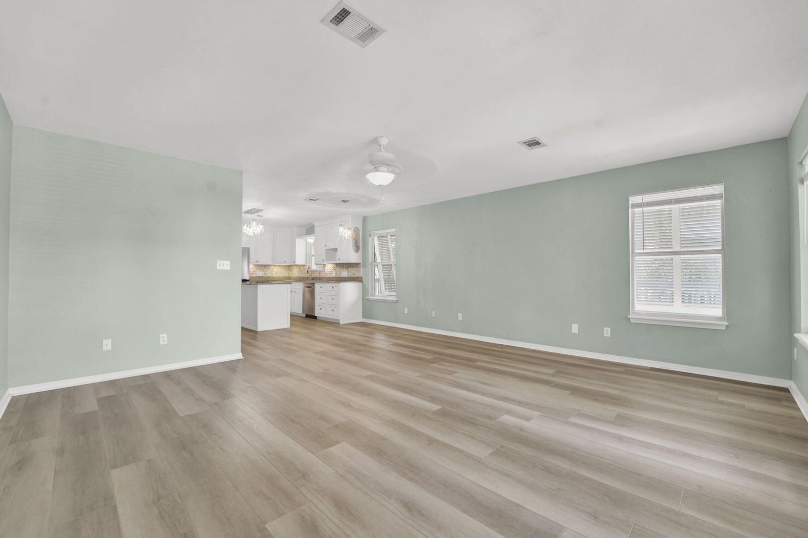 93 Beachfront Trail Santa Rosa Beach, FL 32459 - Photo 3 of 42 wooden floor in an empty room with a window