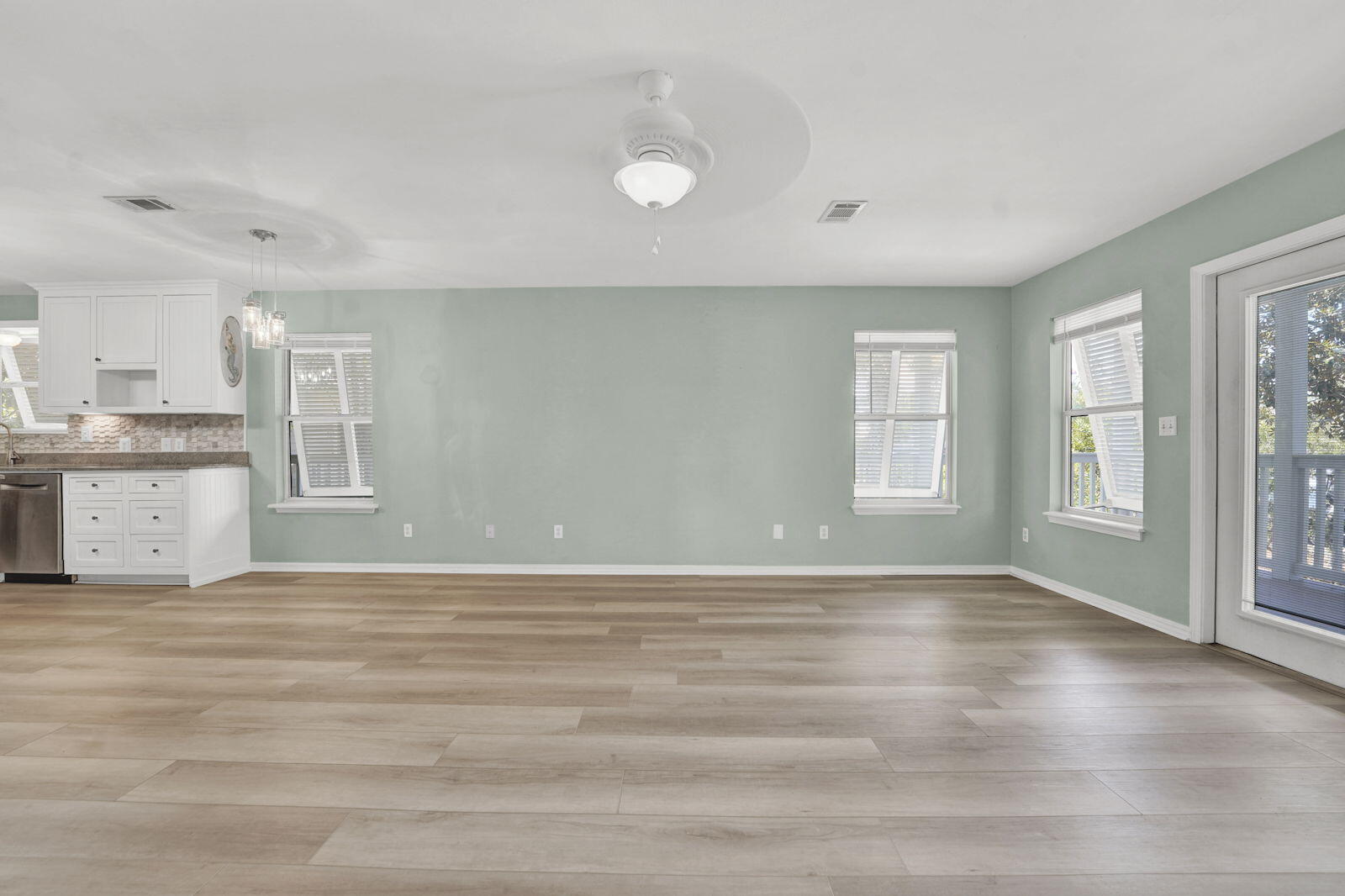 93 Beachfront Trail Santa Rosa Beach, FL 32459 - Photo 4 of 42 an empty room with wooden floor and windows