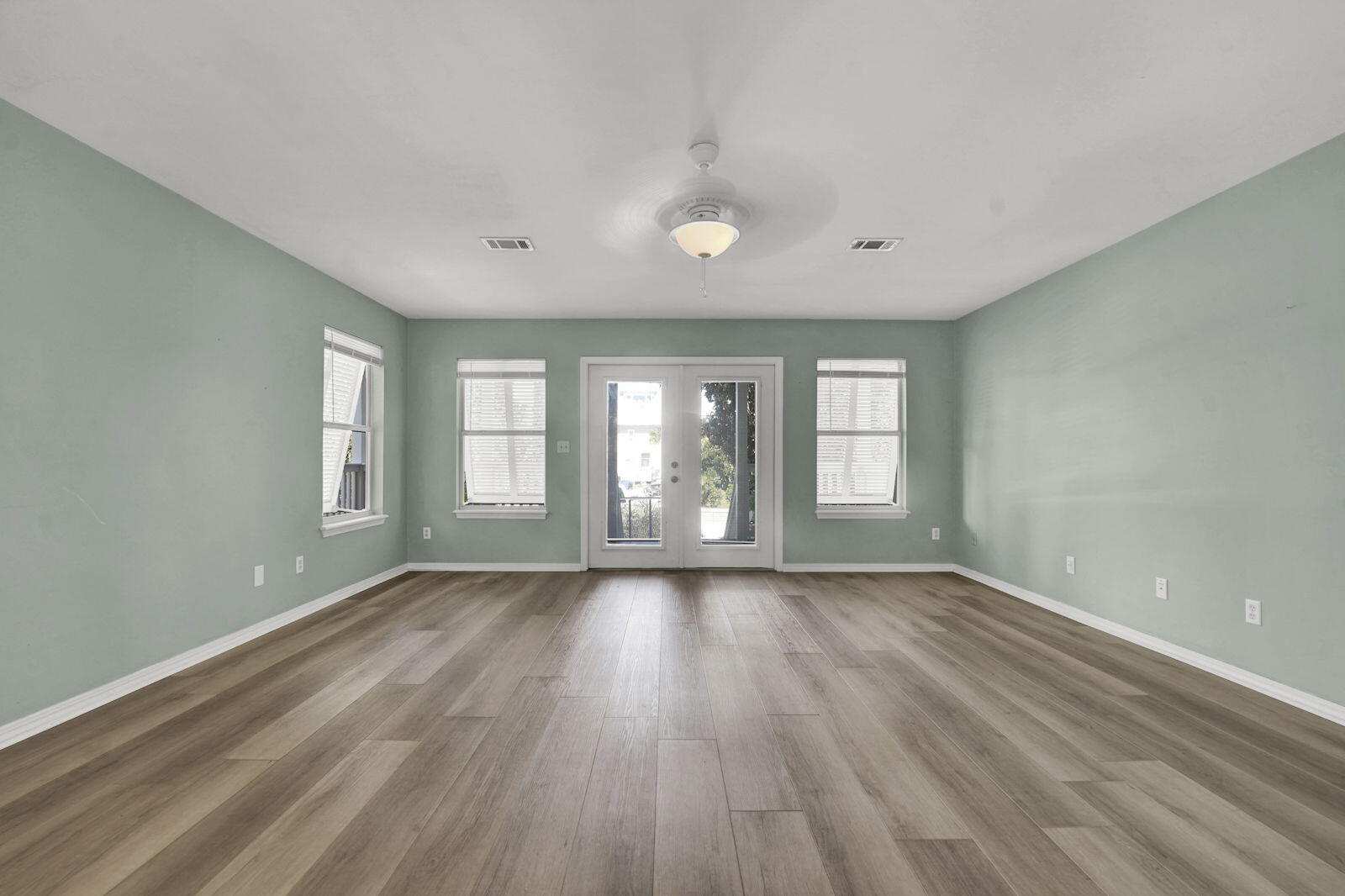 93 Beachfront Trail Santa Rosa Beach, FL 32459 - Photo 5 of 42 a view of an empty room with wooden floor and window