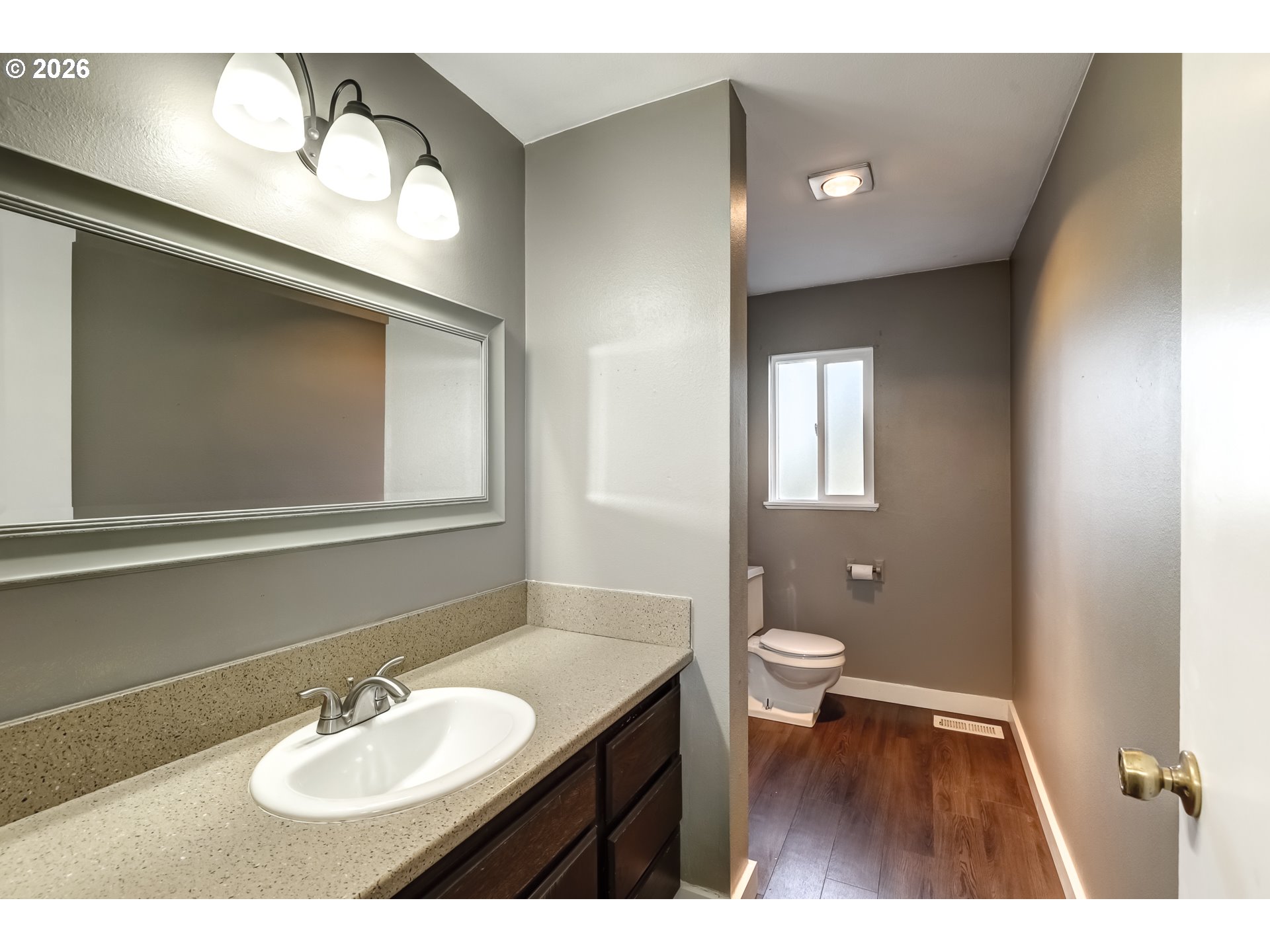 42371 Northwest Banks Road Banks, OR 97106 - Photo 12 of 42 a bathroom with a toilet a sink and mirror