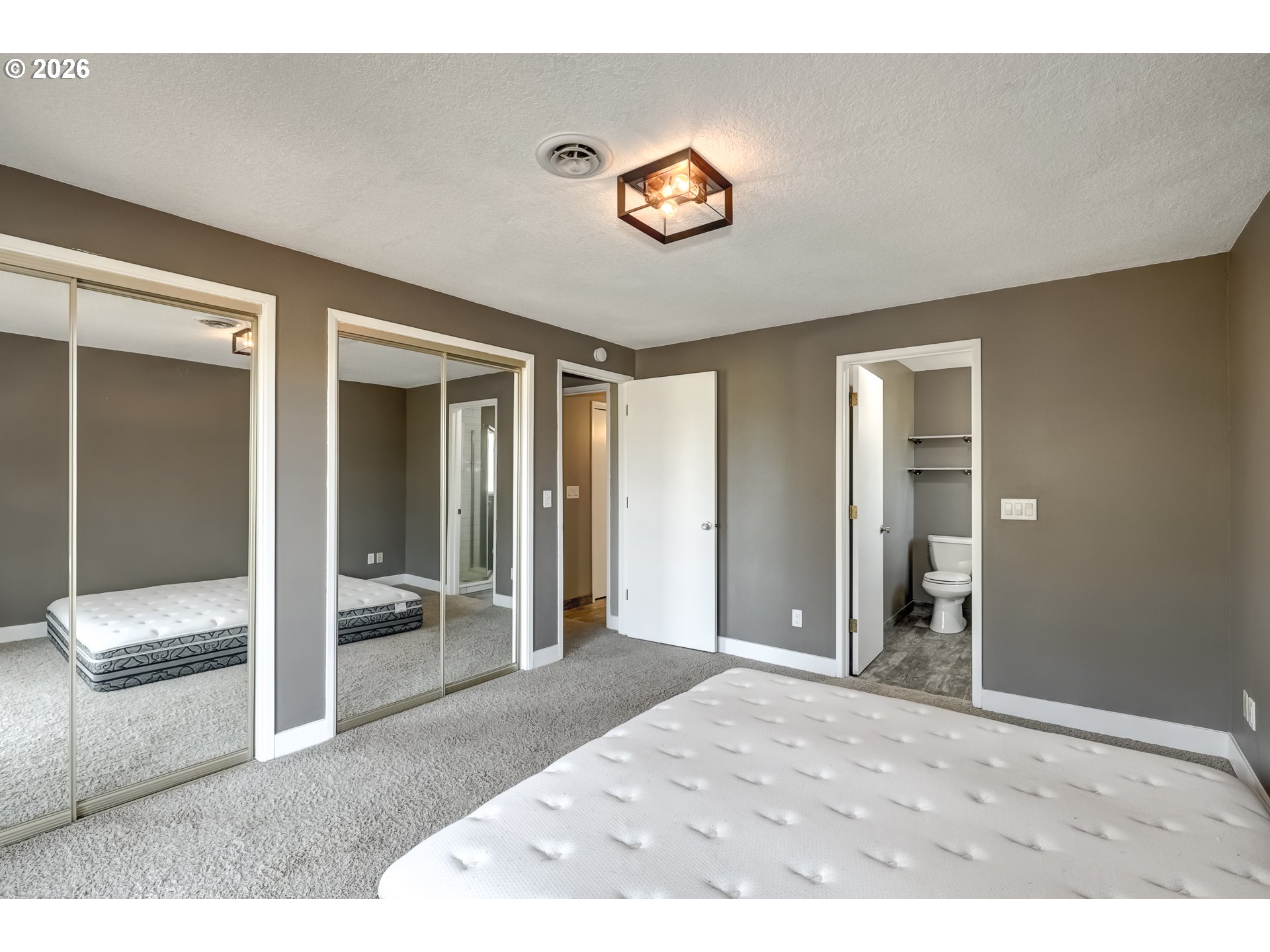42371 Northwest Banks Road Banks, OR 97106 - Photo 14 of 42 a bedroom with a bed and a large mirror