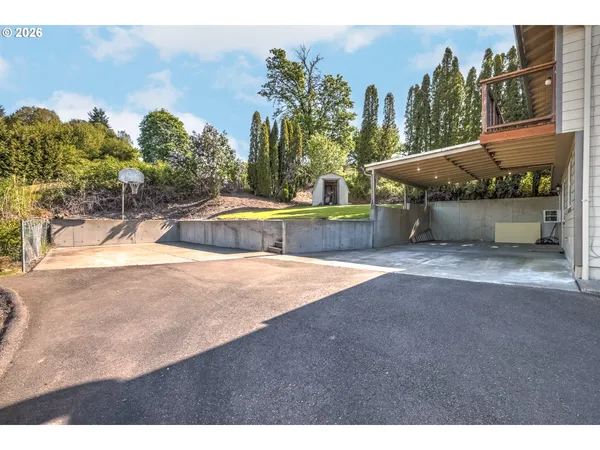a view of a swimming pool with an outdoor space and seating area