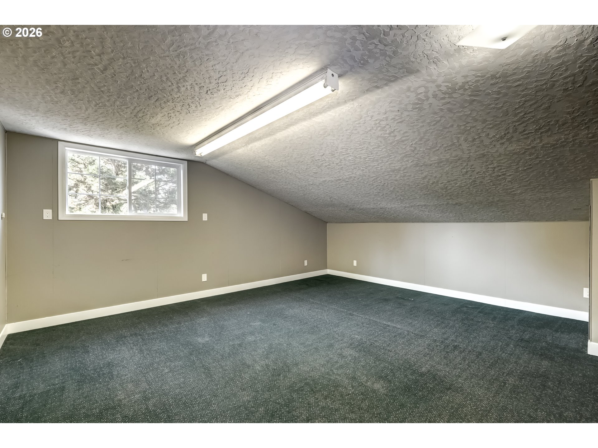 42371 Northwest Banks Road Banks, OR 97106 - Photo 30 of 42 a view of an empty room with wooden floor and window