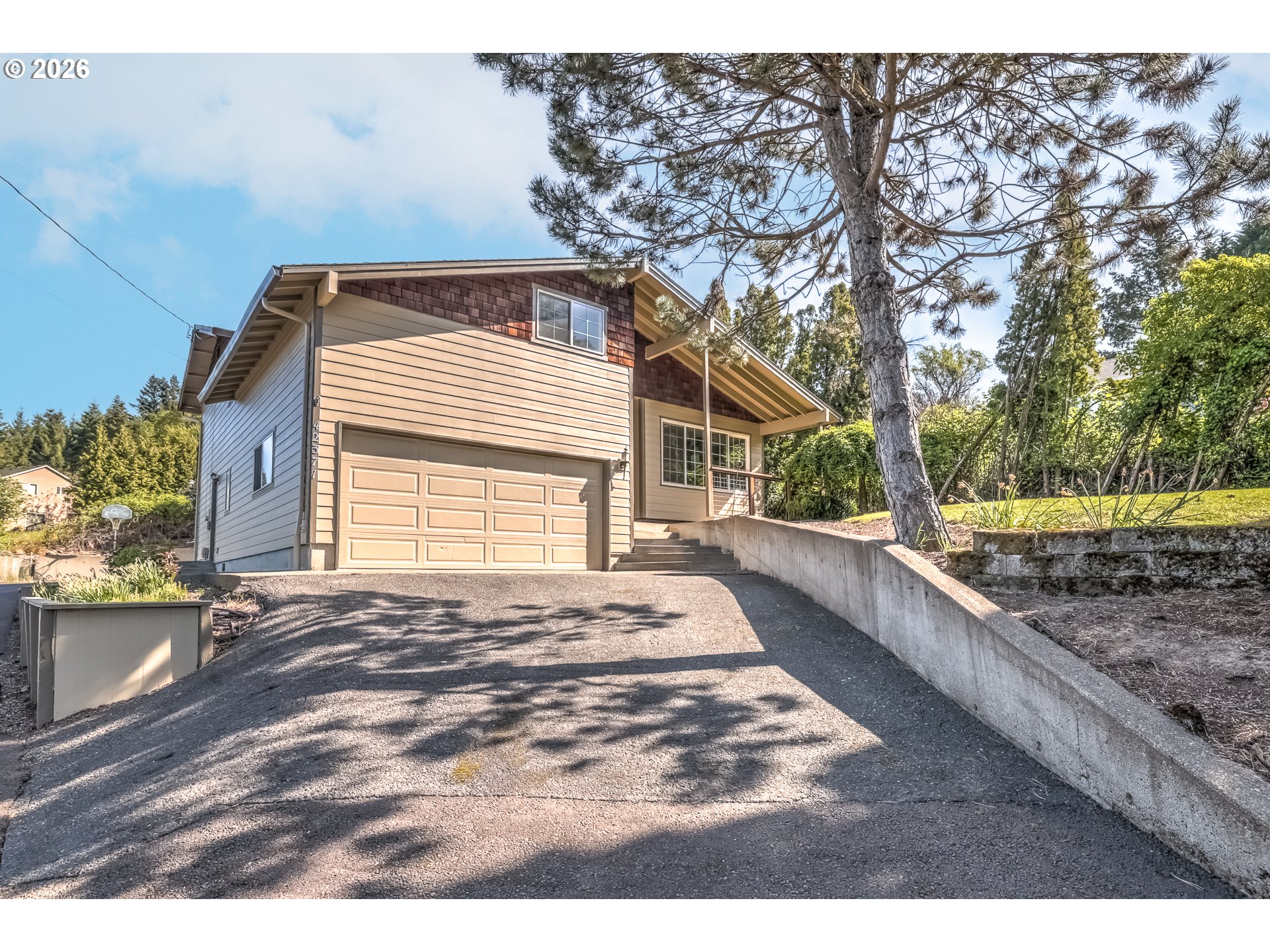 42371 Northwest Banks Road Banks, OR 97106 - Photo 3 of 42 a view of a backyard with large trees and wooden fence