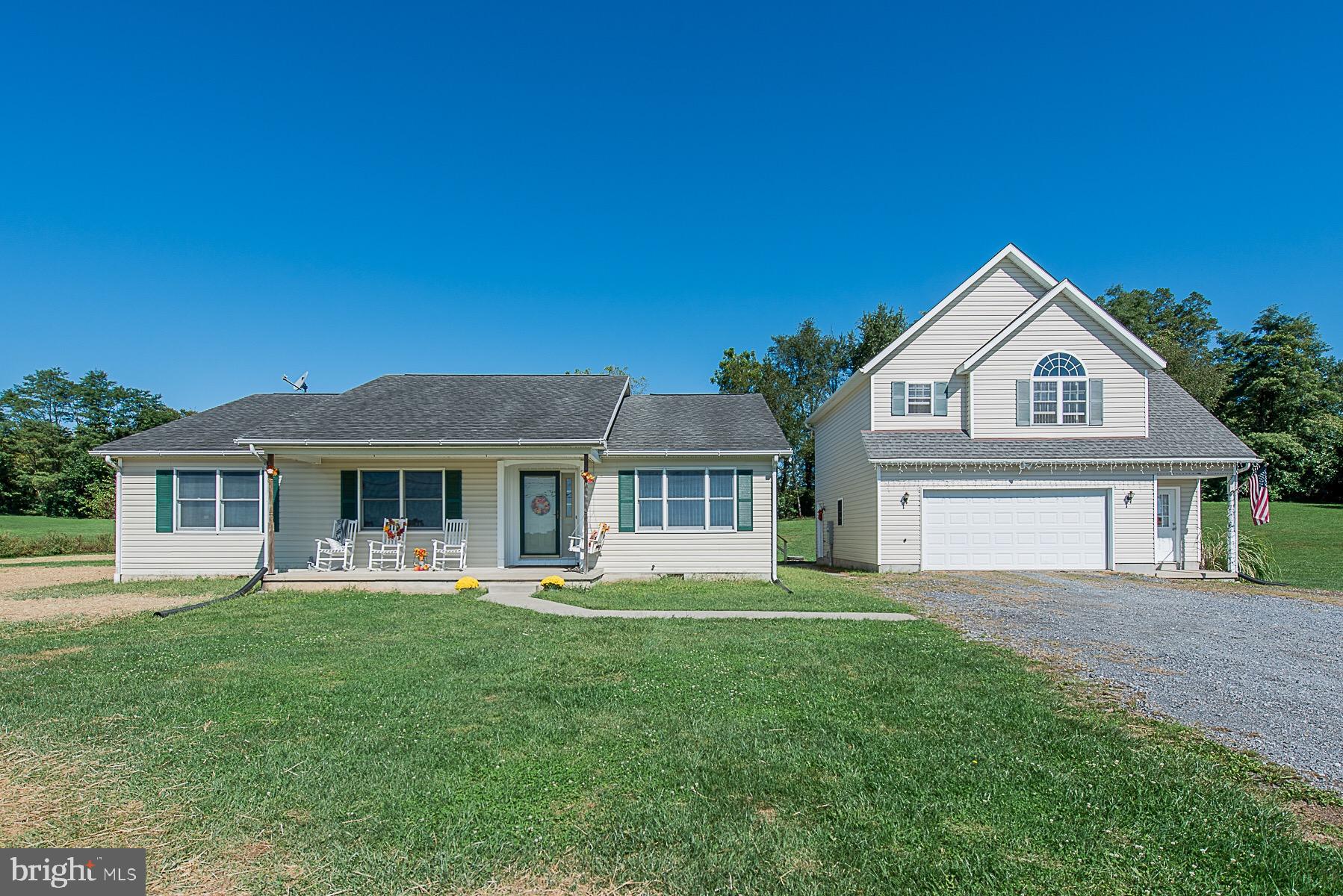 4000 Bark Hill Road Union Bridge, MD 21791 - Photo 2 of 61 a front view of a house with a garden and trees