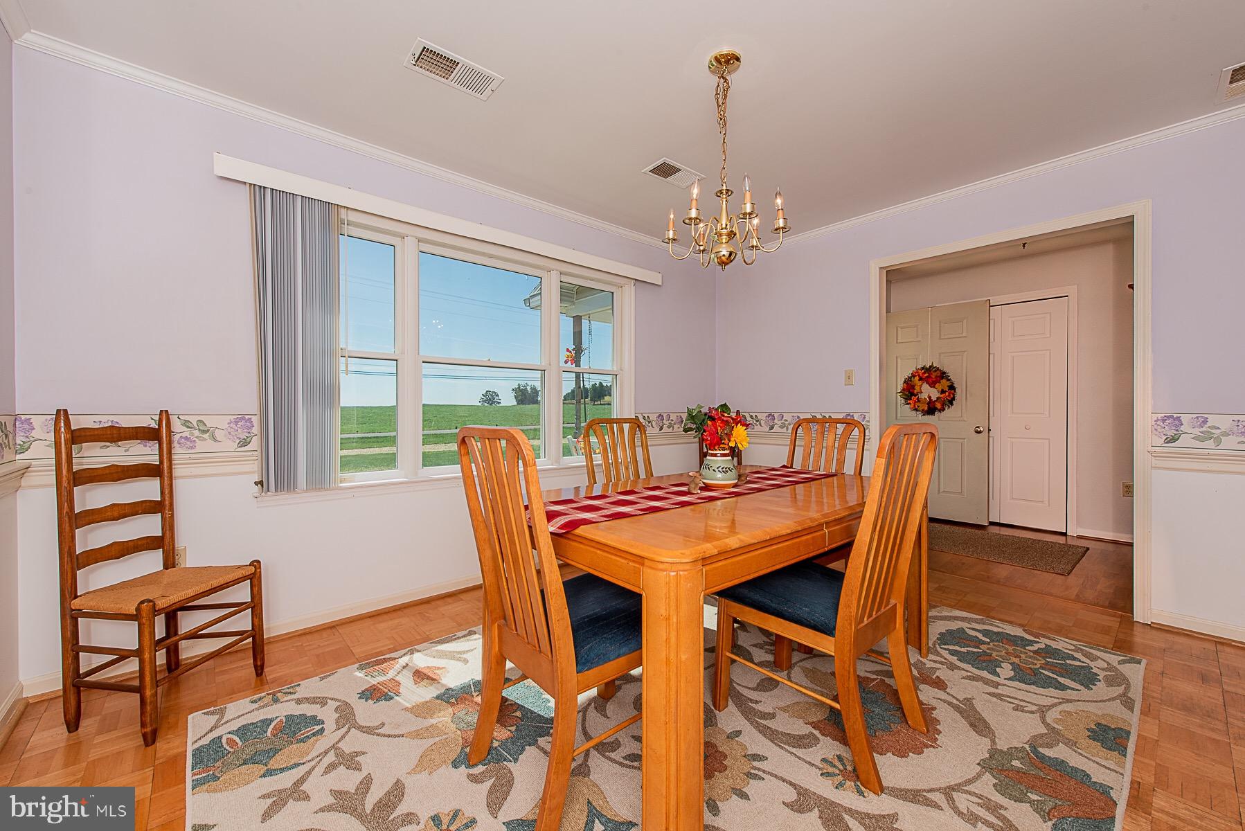 4000 Bark Hill Road Union Bridge, MD 21791 - Photo 11 of 61 a view of a dining room with furniture and a chandelier