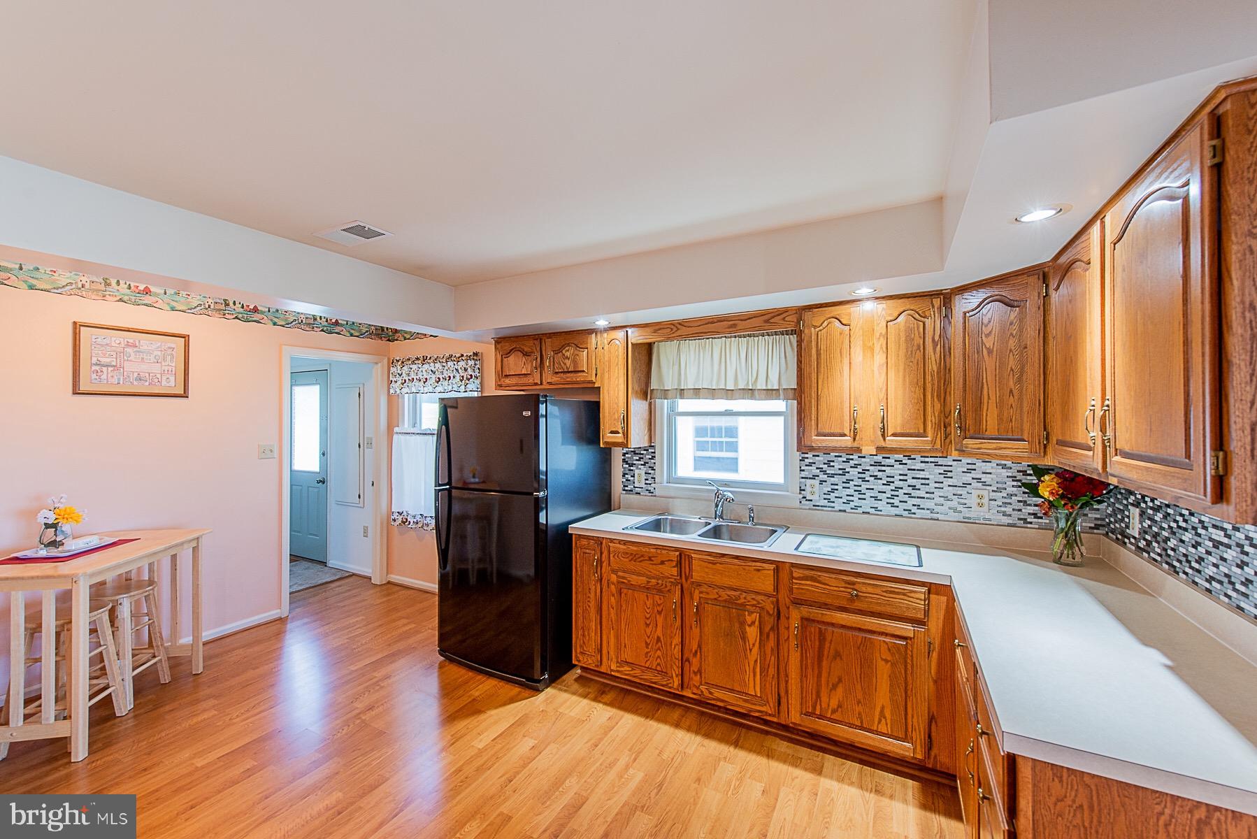 4000 Bark Hill Road Union Bridge, MD 21791 - Photo 14 of 61 a open kitchen with stainless steel appliances granite countertop a refrigerator a sink dishwasher a stove and white countertops with wooden floor