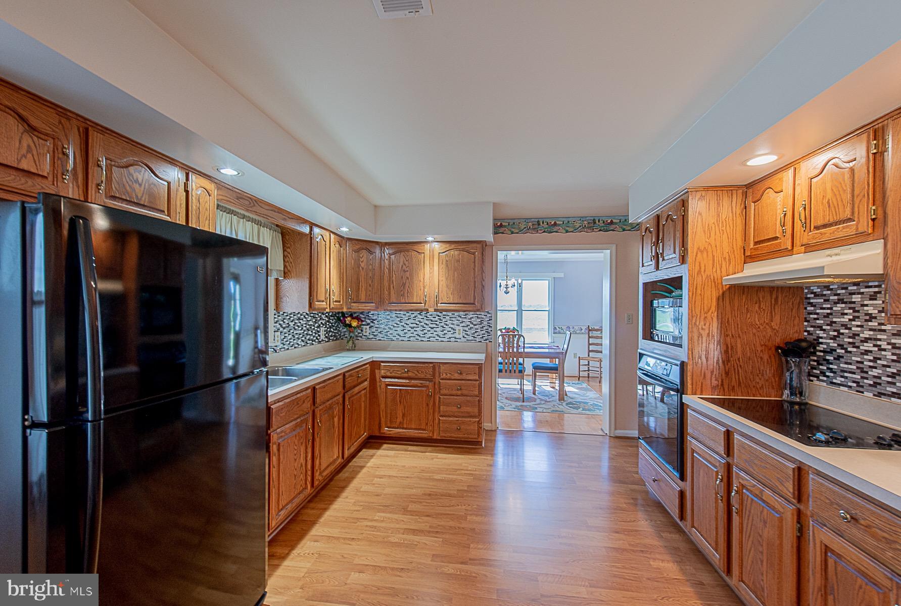 4000 Bark Hill Road Union Bridge, MD 21791 - Photo 17 of 61 a kitchen with stainless steel appliances granite countertop a refrigerator and a stove top oven