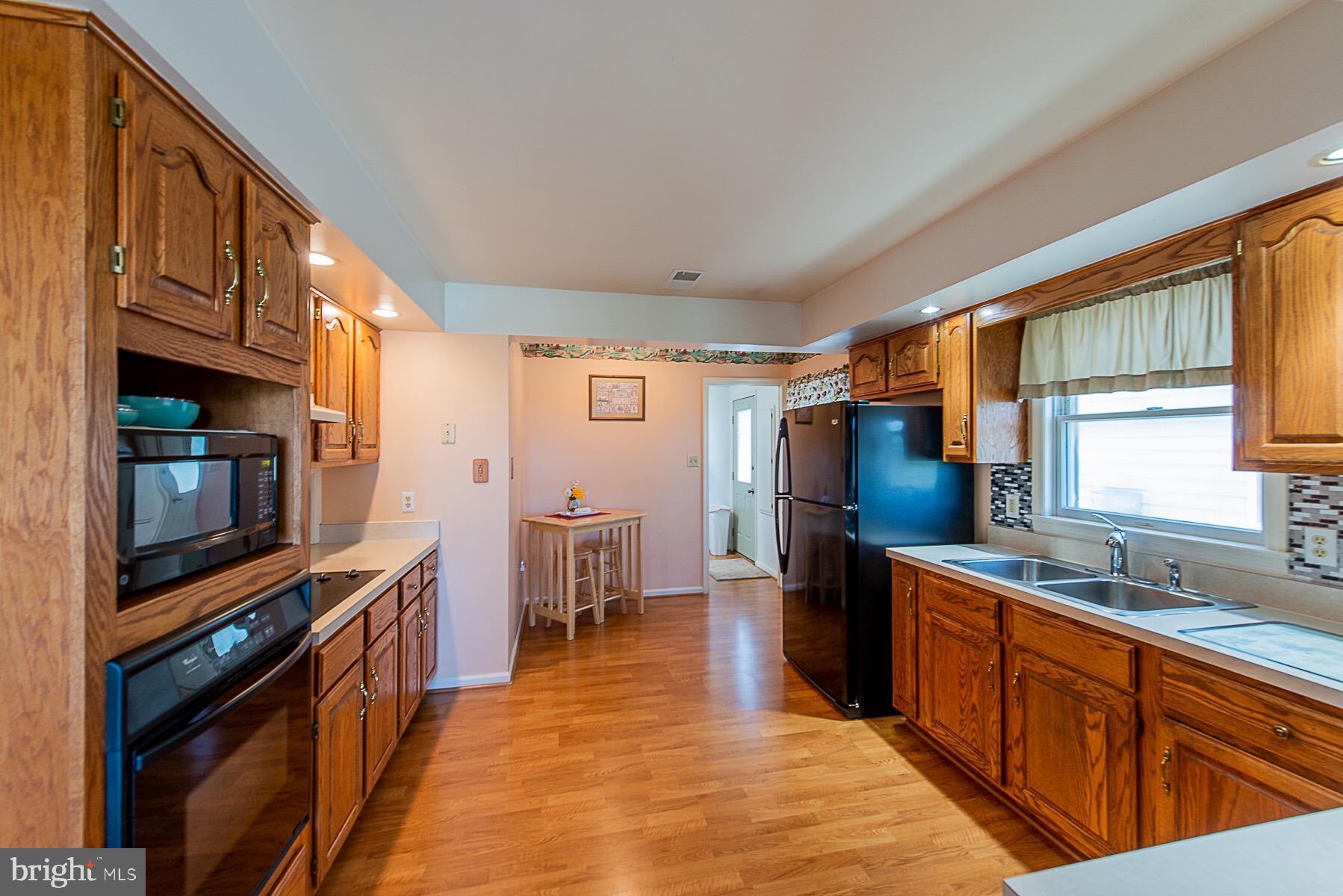4000 Bark Hill Road Union Bridge, MD 21791 - Photo 21 of 61 a large kitchen with stainless steel appliances granite countertop a refrigerator and a stove top oven