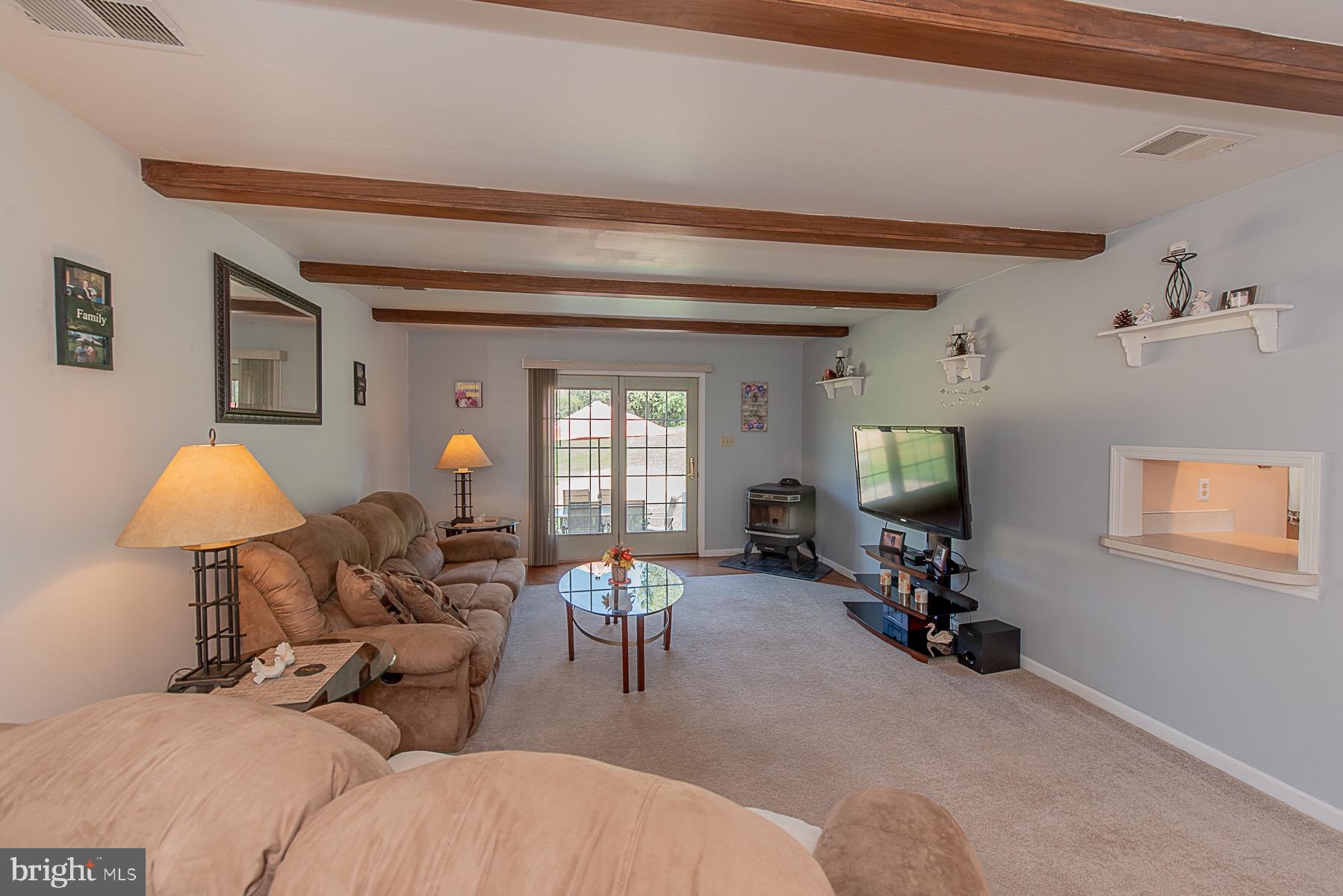 4000 Bark Hill Road Union Bridge, MD 21791 - Photo 22 of 61 a living room with furniture and a lamp