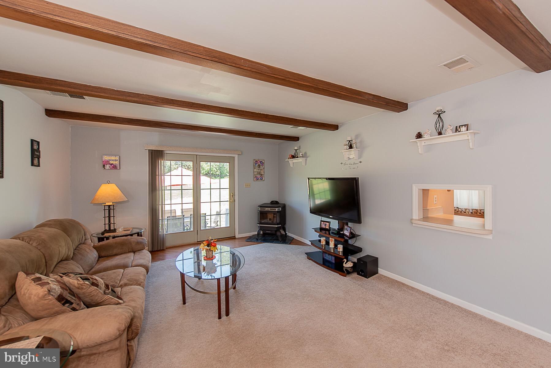 4000 Bark Hill Road Union Bridge, MD 21791 - Photo 24 of 61 a living room with furniture and a flat screen tv