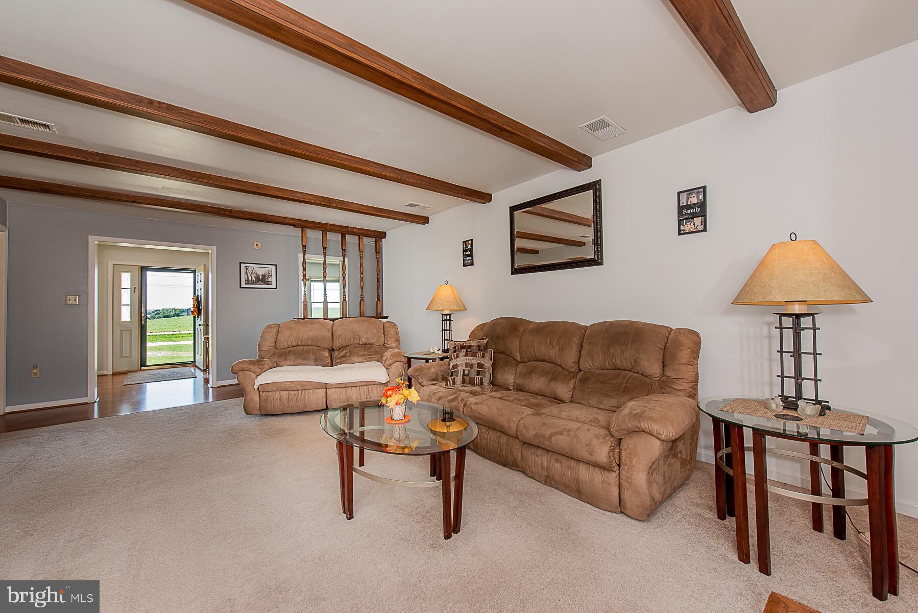 4000 Bark Hill Road Union Bridge, MD 21791 - Photo 25 of 61 a living room with furniture and a lamp