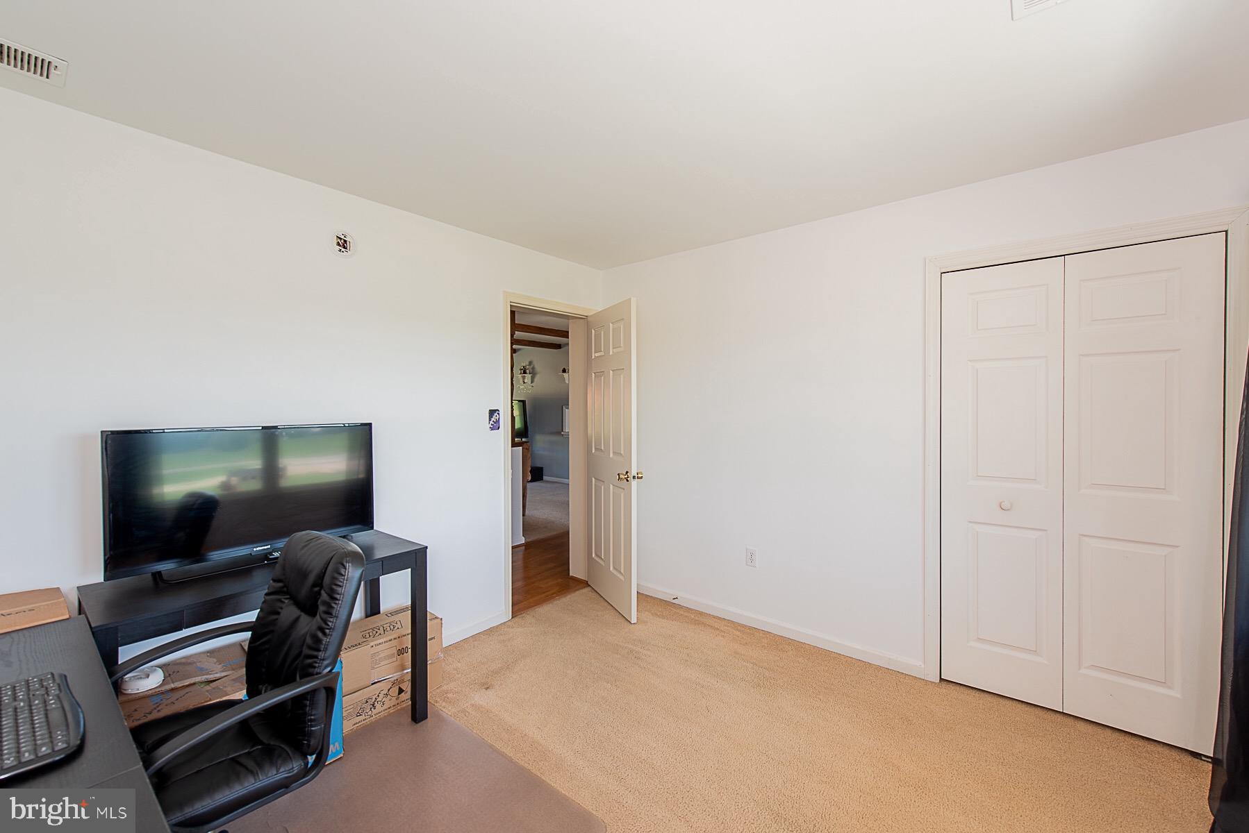 4000 Bark Hill Road Union Bridge, MD 21791 - Photo 27 of 61 a living room with furniture and a flat screen tv