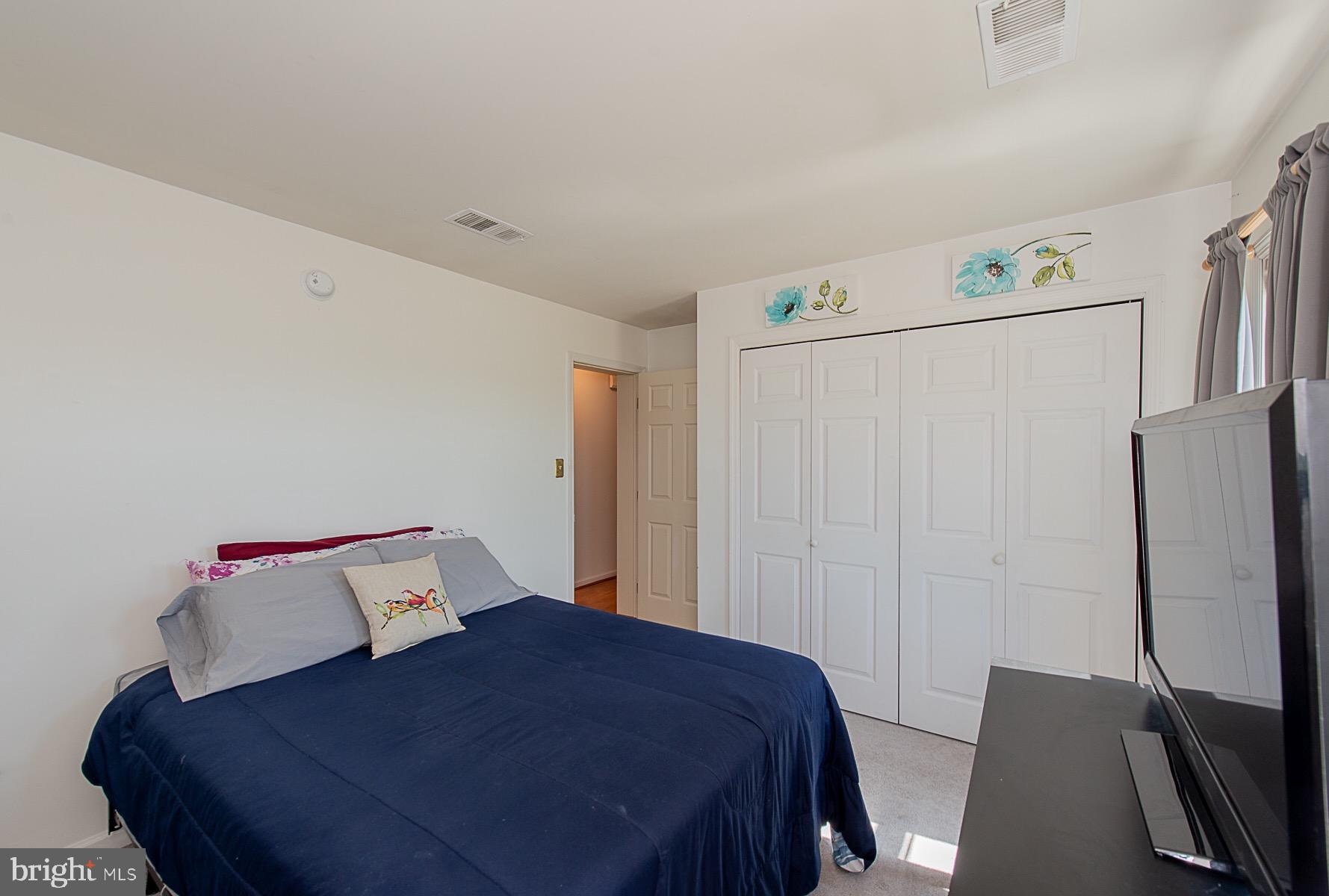 4000 Bark Hill Road Union Bridge, MD 21791 - Photo 28 of 61 a bedroom with a bed and a flat tv screen