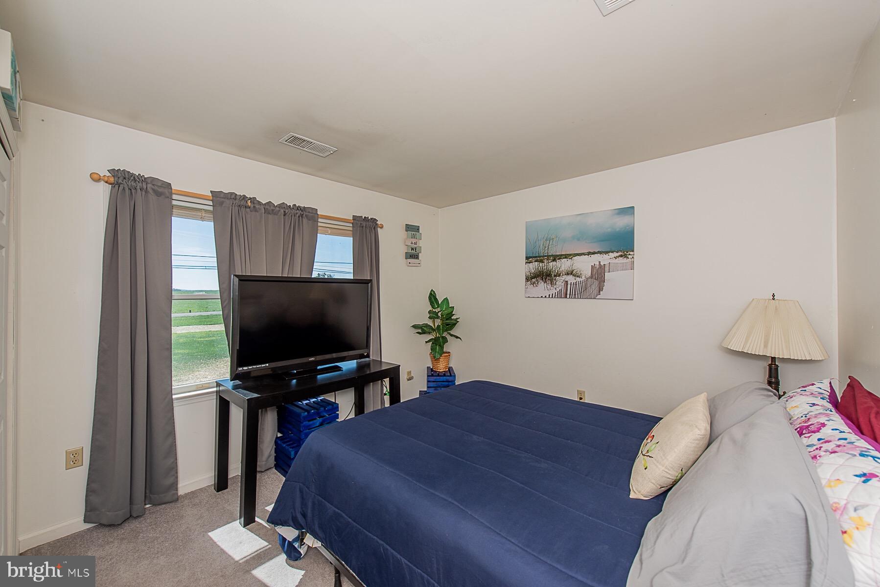 4000 Bark Hill Road Union Bridge, MD 21791 - Photo 29 of 61 a bedroom with a bed and a flat screen tv